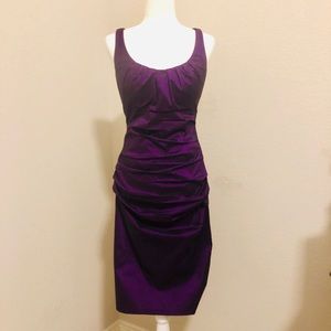 Knee length, fitted purple dress